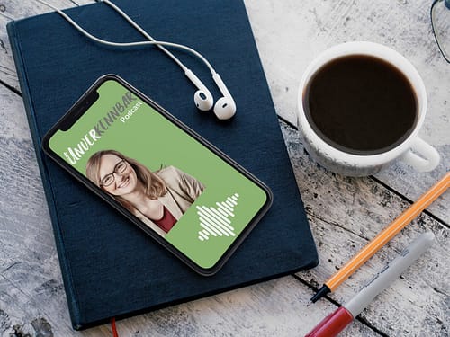 iphone-x-mockup-lying-on-top-of-a-book-while-near-a-coffee-cup-and-headphones-a17220-min